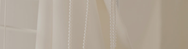a close up of a curtain with a white background