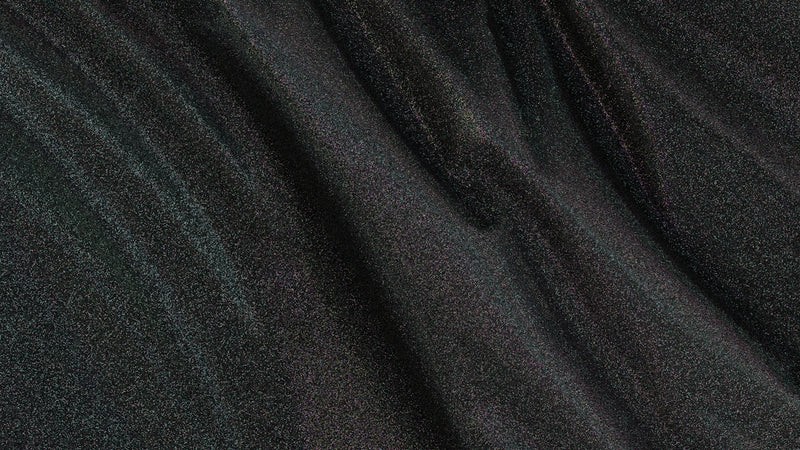 Dark fabric shows creases and waves.