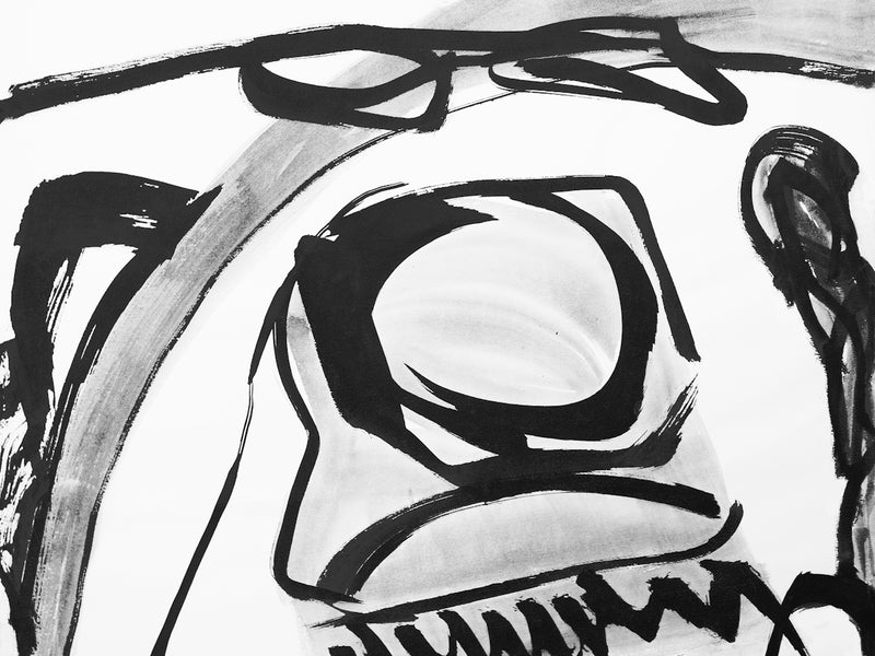 Abstract black and white brush strokes create a face