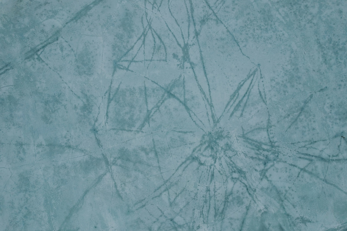 a close up of a blue wall with a pattern on it