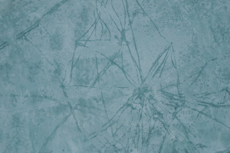 a close up of a blue wall with a pattern on it