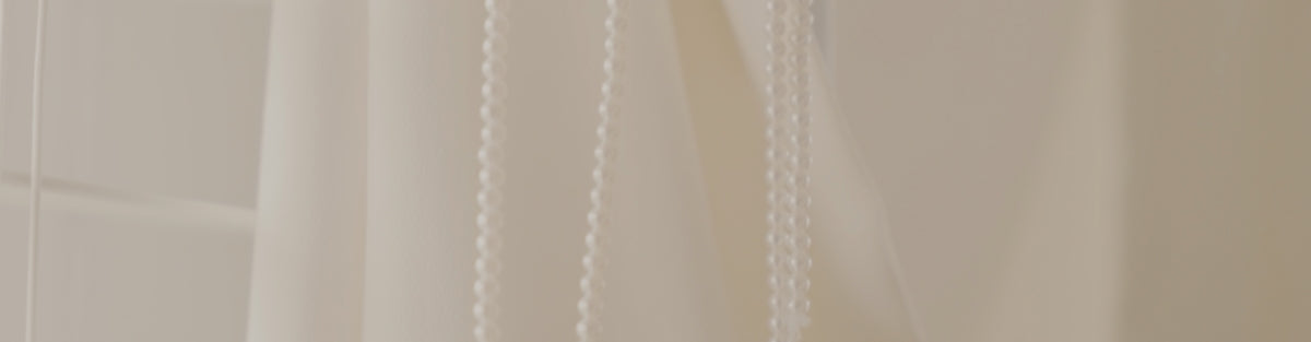 a close up of a curtain with a white background
