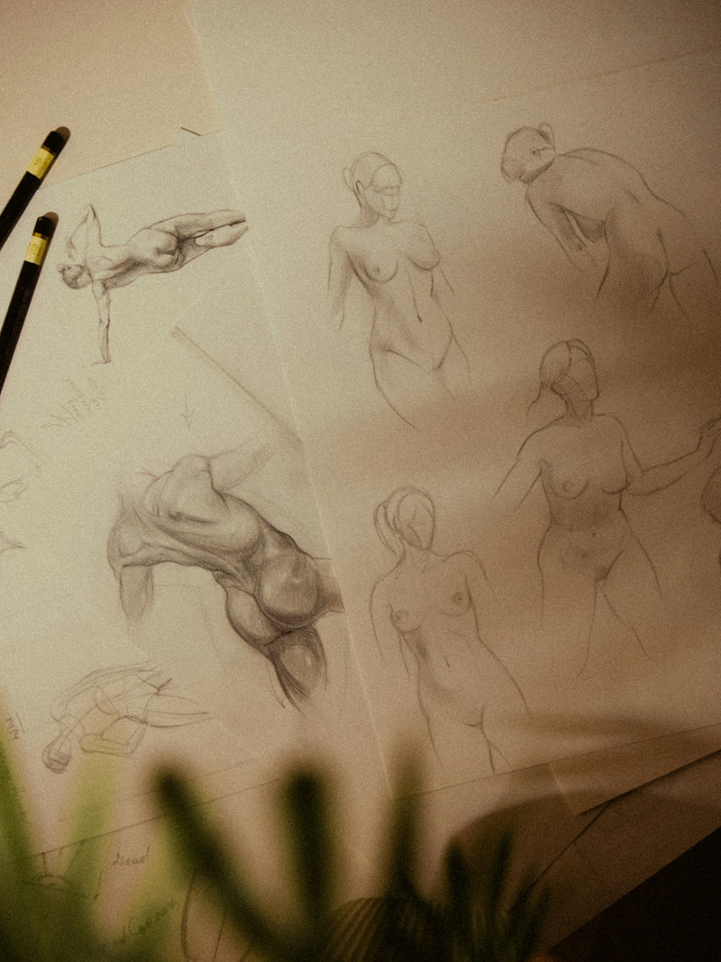 Pencil sketches of human figures and anatomy studies.